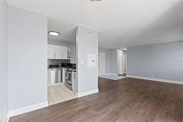 a view of kitchen with wooden floor