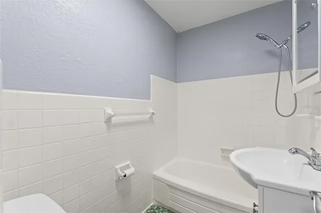 a bathroom with a sink and toilet
