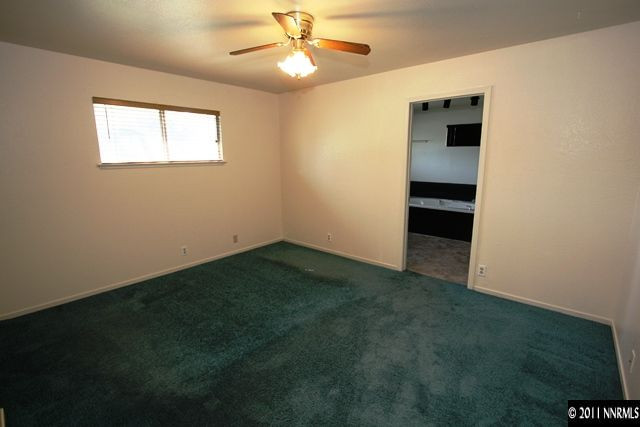 1425 Allen Street Reno, NV 89509 - Photo 6 of 13 an empty room with windows and fan