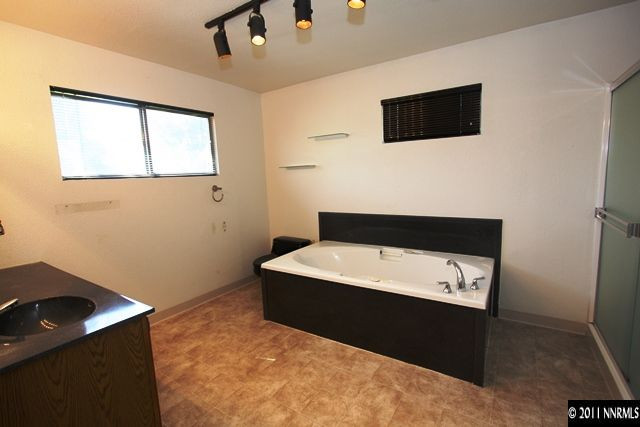 1425 Allen Street Reno, NV 89509 - Photo 7 of 13 a room with a bed and a flat screen tv