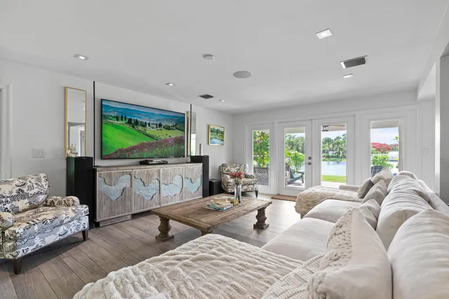 a spacious bedroom with a bed a couch and a window