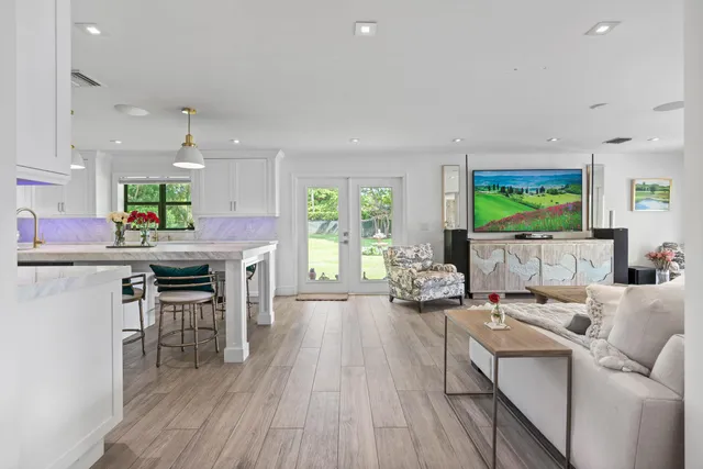 a large bathroom with a sink mirror and a shower