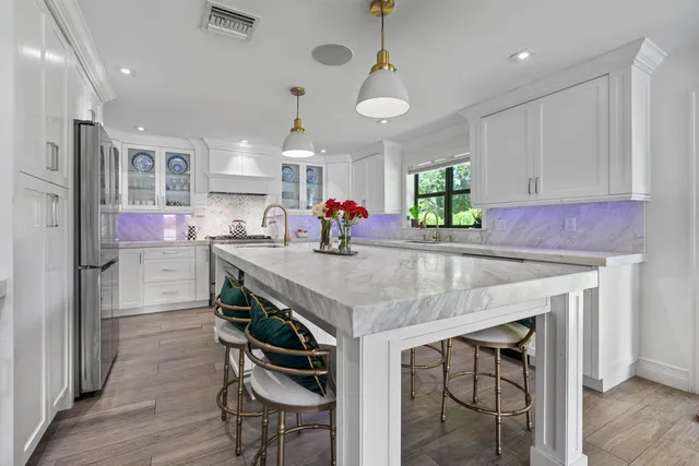 a spacious bathroom with a sink double vanity and a mirror