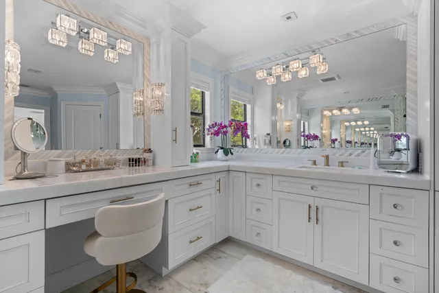 an aerial view of residential houses with outdoor space and parking