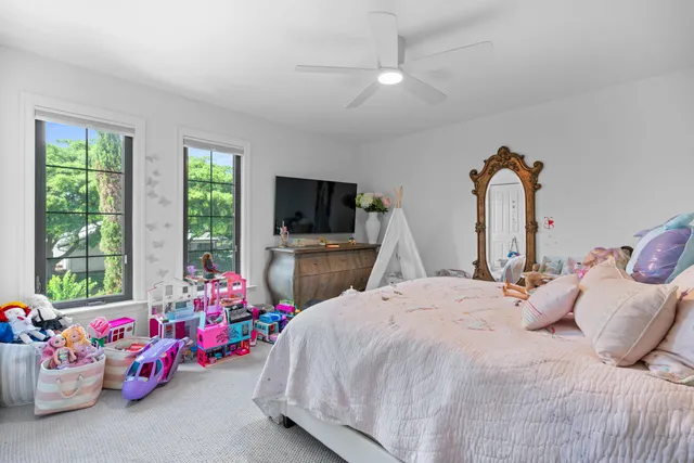 a front view of a building with a garden