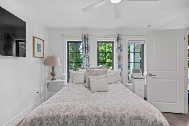 a view of an house with backyard and sitting area