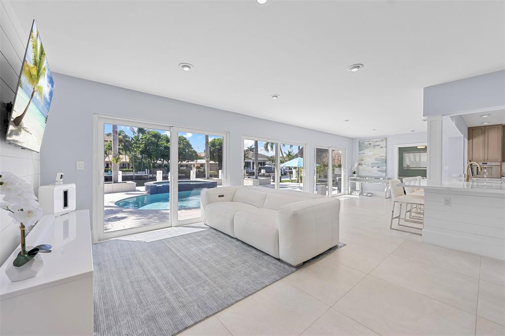 2330 Northeast 35th Street Lighthouse Point, FL 33064 - Photo 11 of 71 a living room with furniture and a flat screen tv