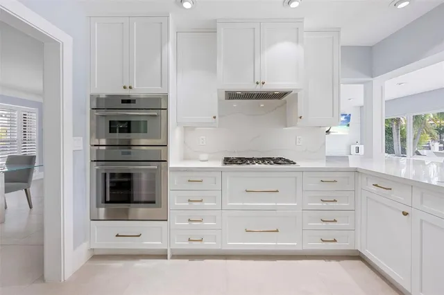 a bathroom with a shower sink and mirror