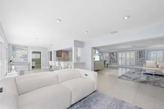 a room with a bed and a chandelier