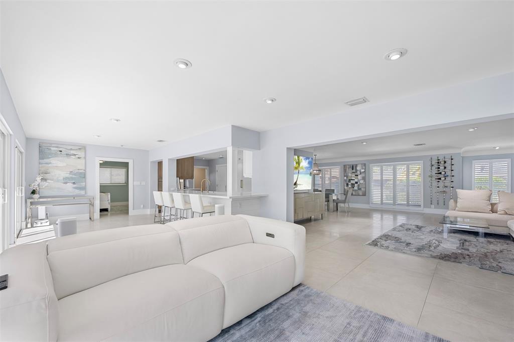 2330 Northeast 35th Street Lighthouse Point, FL 33064 - Photo 21 of 71 a living room with furniture and a flat screen tv