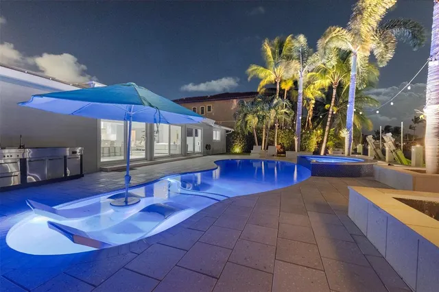 a bedroom with a bed and painting on the wall