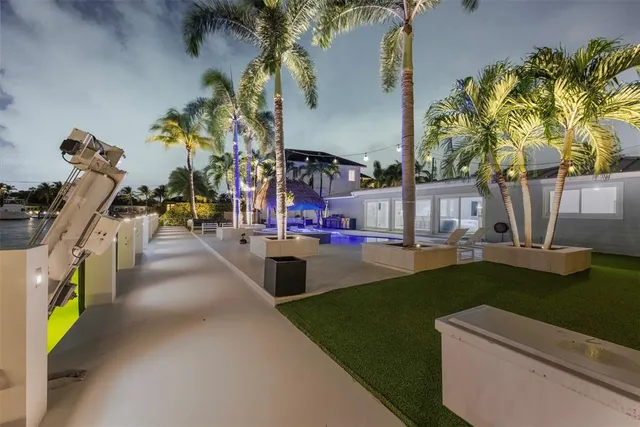 a front view of house with a garden and patio