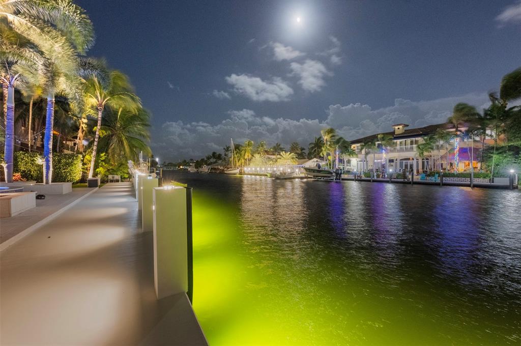 2330 Northeast 35th Street Lighthouse Point, FL 33064 - Photo 46 of 71 a view of a lake with a building in the background