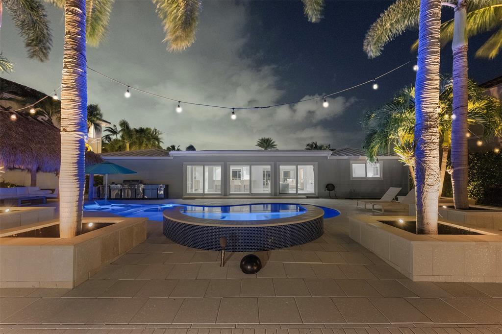 2330 Northeast 35th Street Lighthouse Point, FL 33064 - Photo 5 of 71 a living room with furniture and a fireplace