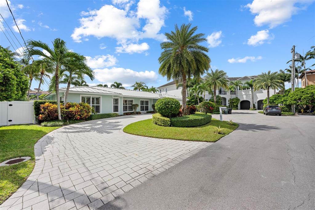2330 Northeast 35th Street Lighthouse Point, FL 33064 - Photo 70 of 71 a front view of house with yard and green space