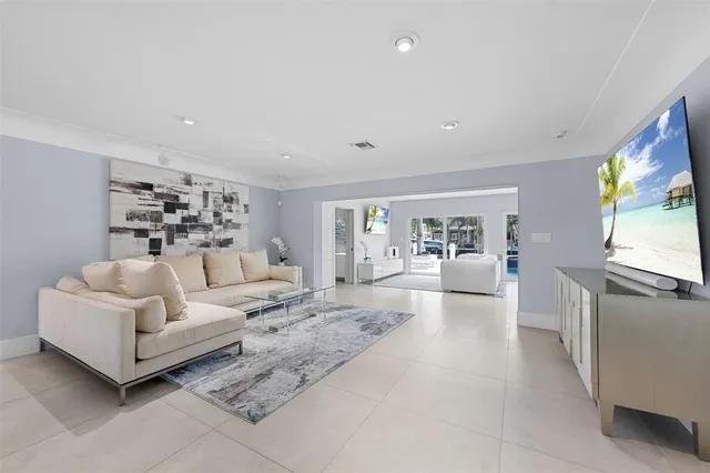 a large white kitchen with white cabinets and a stove