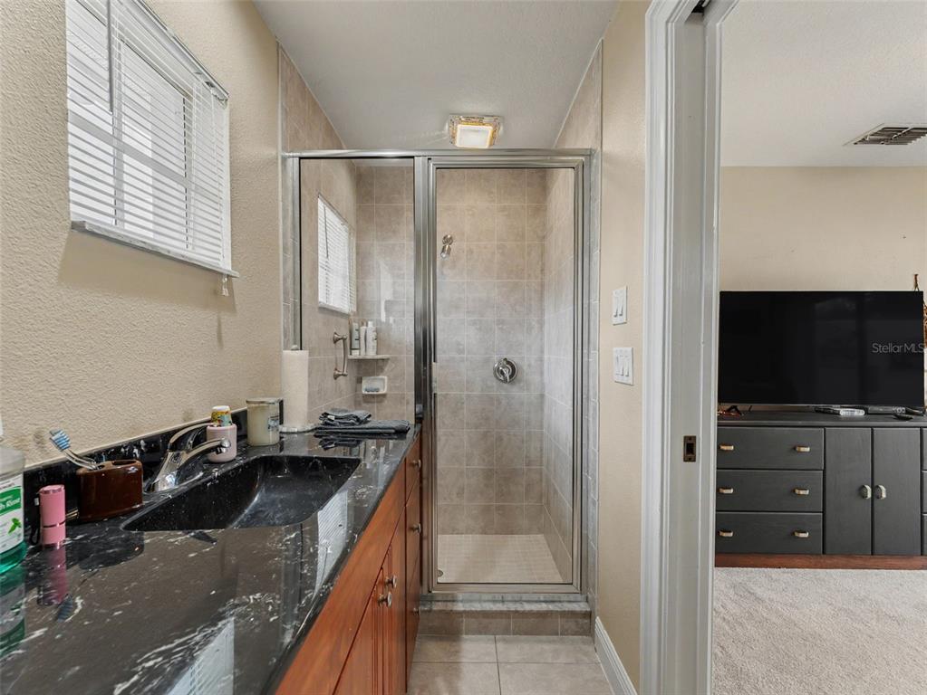 8910 Jericho Road Weeki Wachee, FL 34613 - Photo 10 of 52 a kitchen with a refrigerator and a sink