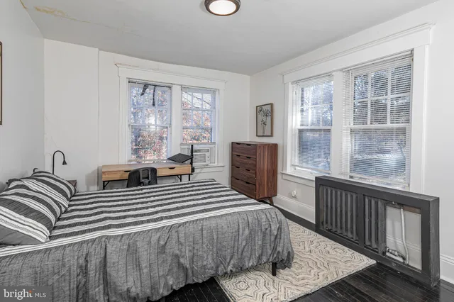 a bedroom with a bed and a closet