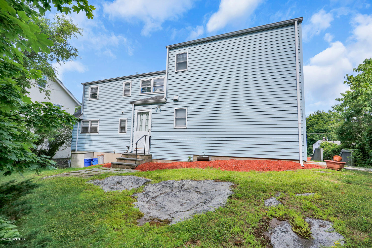 2 Booth Terrace Greenwich, CT 06830 - Photo 2 of 8 a front view of house with yard