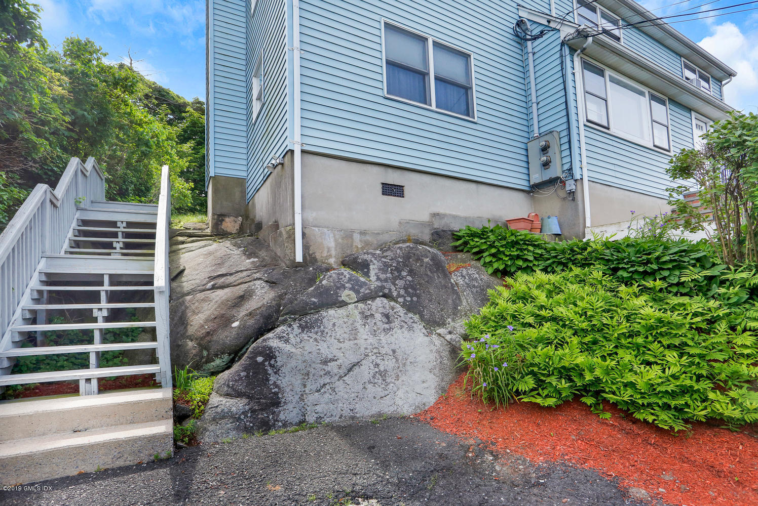 2 Booth Terrace Greenwich, CT 06830 - Photo 4 of 8 a view of a house with backyard and trees