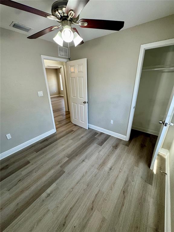 1912 West Grace Street Tampa, FL 33607 - Photo 15 of 22 wooden floor in an empty room with a window