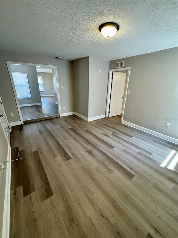 1912 West Grace Street Tampa, FL 33607 - Photo 19 of 22 a view of an empty room and wooden floor