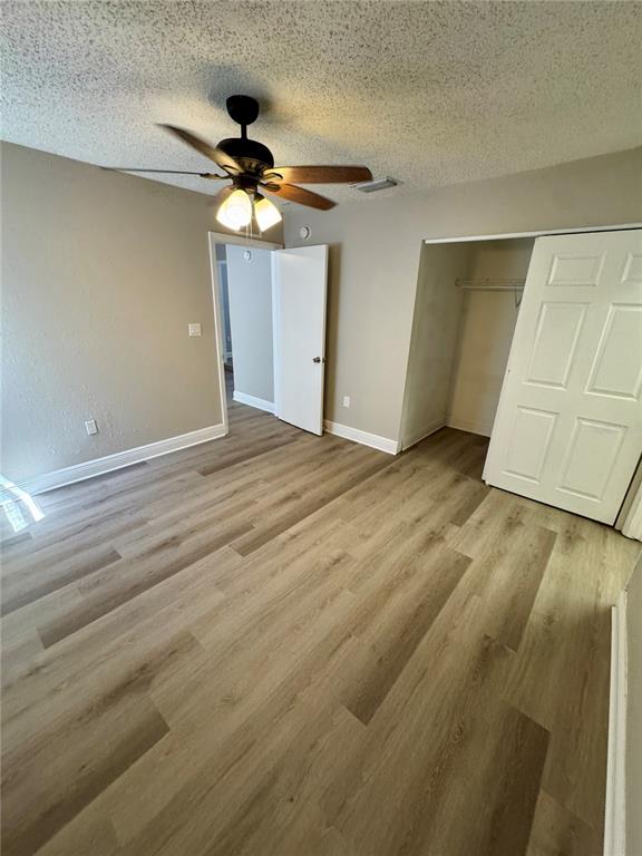 1912 West Grace Street Tampa, FL 33607 - Photo 22 of 22 a view of a livingroom with wooden floor and a ceiling fan