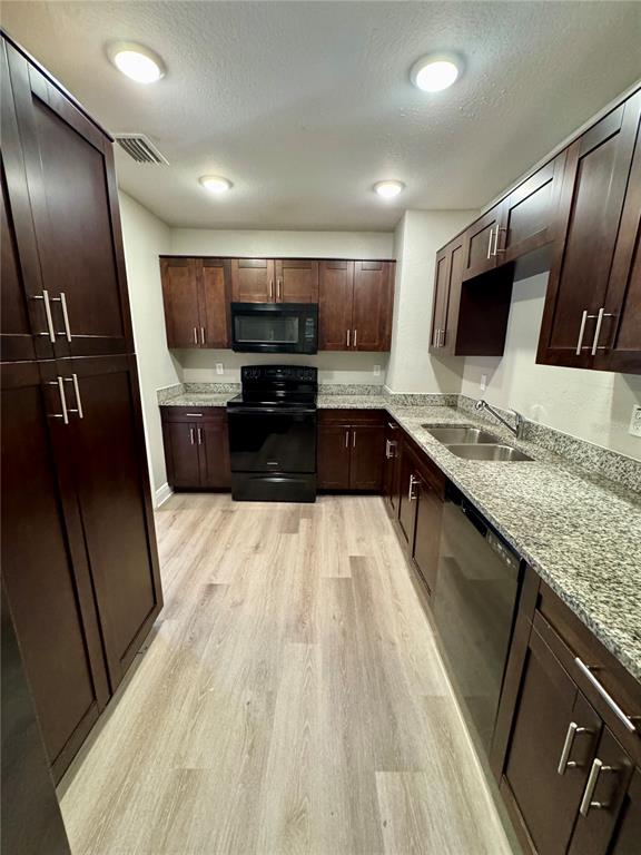 1912 West Grace Street Tampa, FL 33607 - Photo 9 of 22 a large kitchen with a stove and a sink