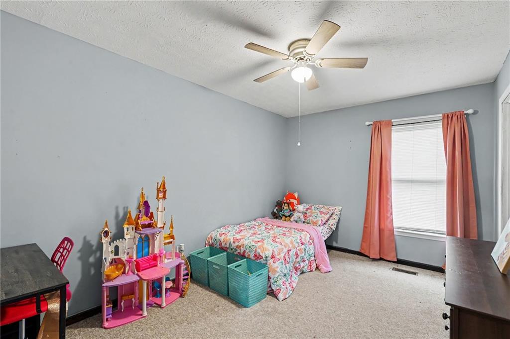 7388 Post Road Winston, GA 30187 - Photo 15 of 32 a bedroom with furniture and a window