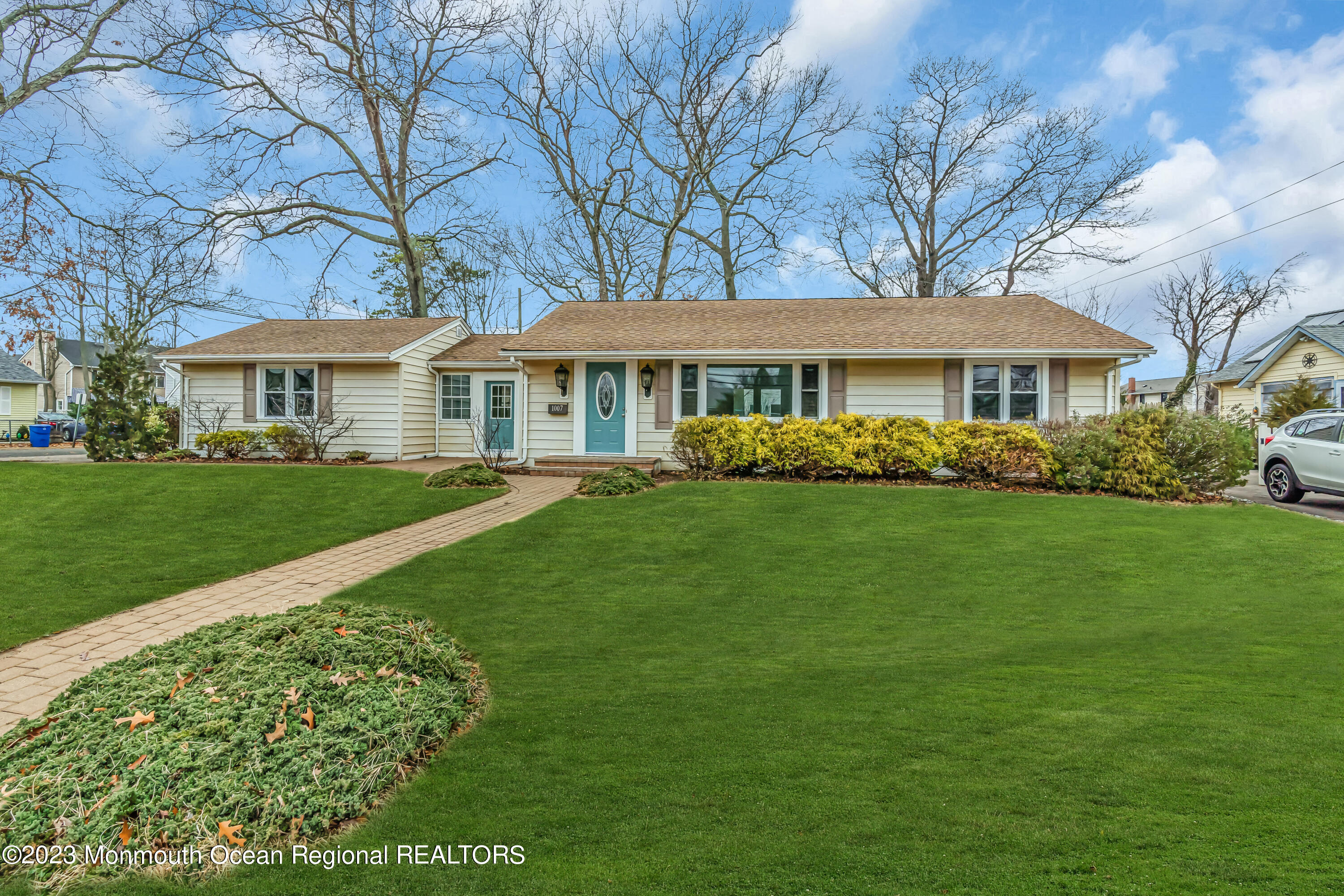 1007 Beaver Dam Road Point Pleasant, NJ 08742 - Photo 3 of 45 a front view of a house with a garden