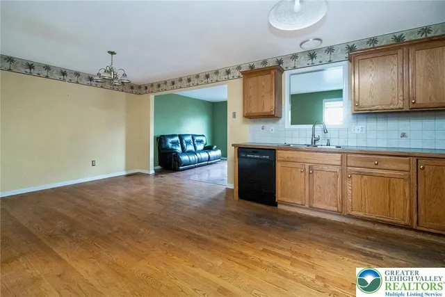 a kitchen with a sink cabinets and window