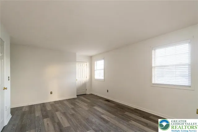 a view of an empty room and window