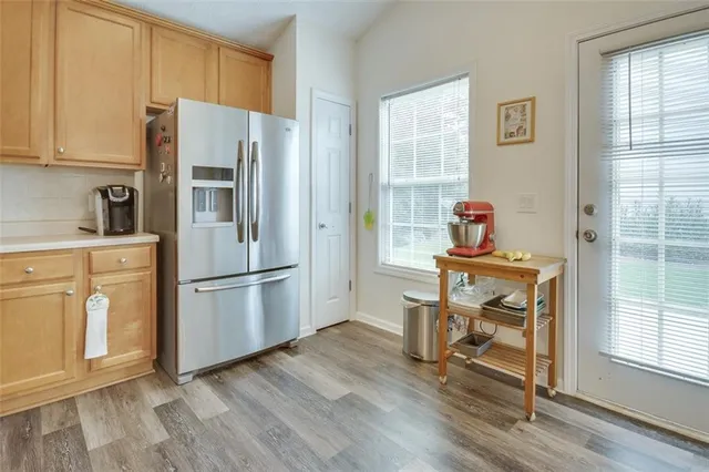 a kitchen with stainless steel appliances granite countertop a stove microwave and cabinets