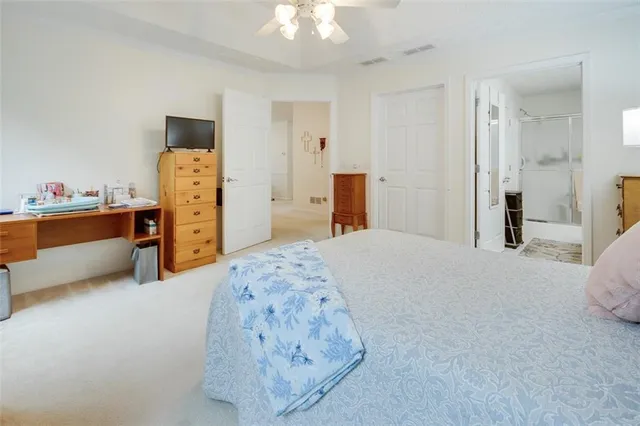 a bed room with a bed and a chandelier