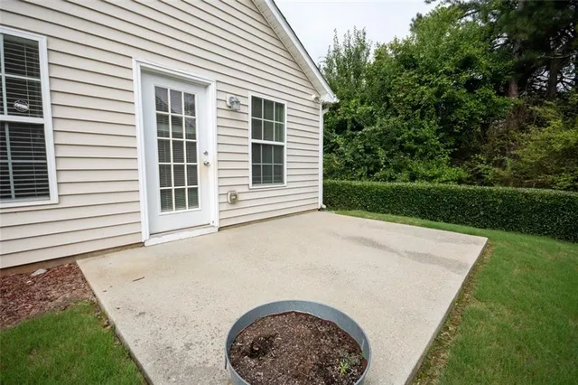 a front view of house with a garden and yard