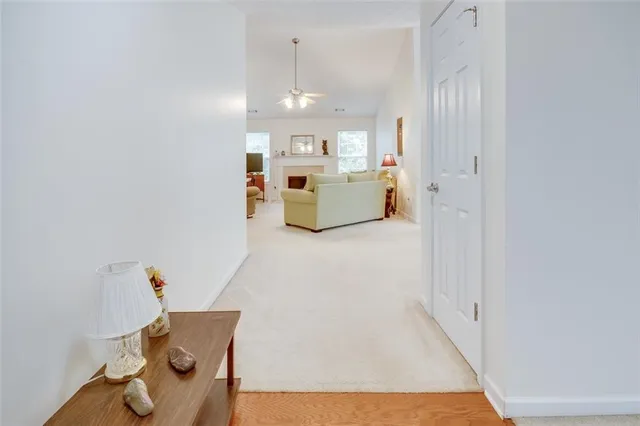 a view of kitchen and entryway with wooden floor