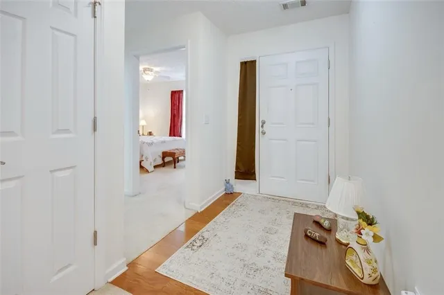 a living room with furniture a dining table and a fireplace