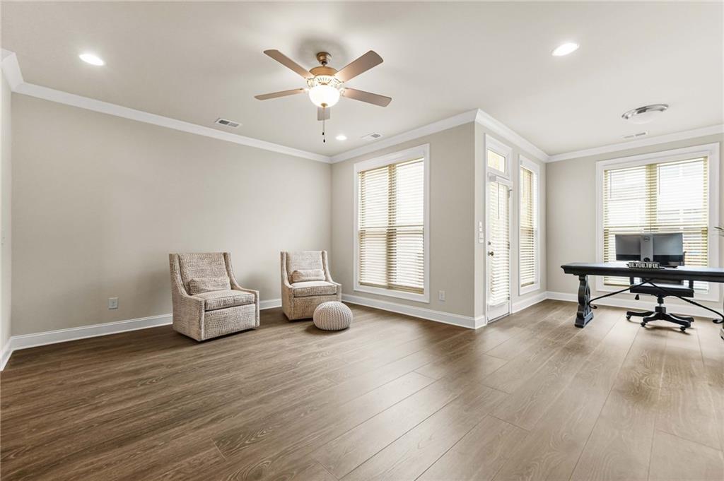 2207 Parkside Gln View Duluth, GA 30097 - Photo 11 of 41 a living room with furniture and a wooden floor