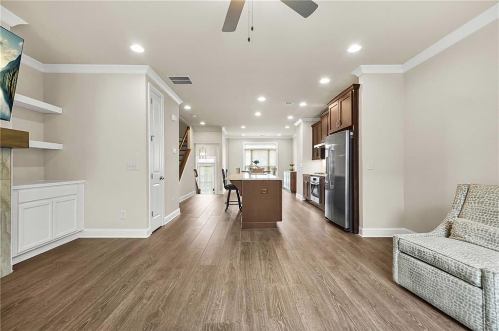 2207 Parkside Gln View Duluth, GA 30097 - Photo 12 of 41 a living room with stainless steel appliances furniture refrigerator and a kitchen view