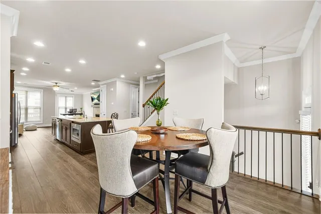 a view of a dining room with furniture and wooden floor