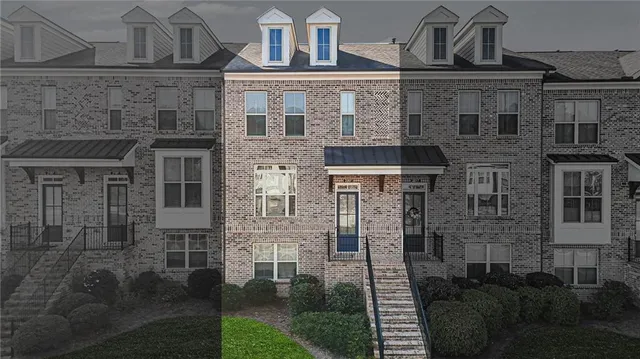 a front view of a building with glass windows