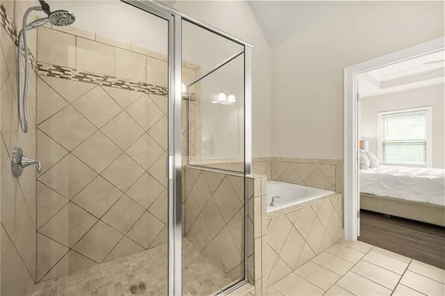 a bathroom with a bathtub and a shower