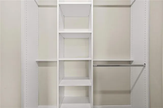 a view of an empty walk in closet