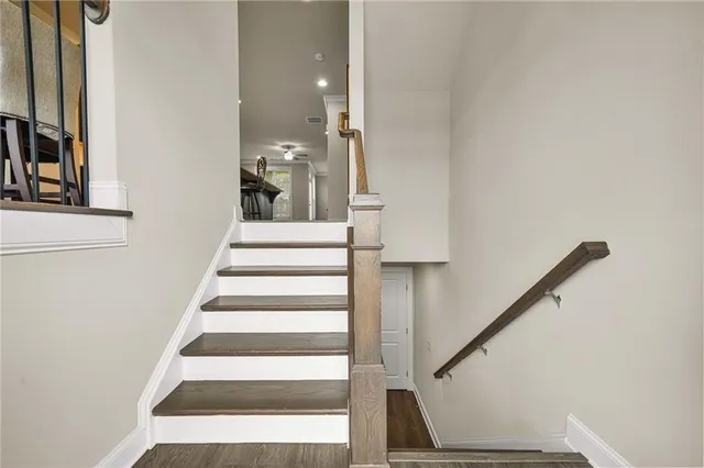 a view of entryway and hall with wooden floor