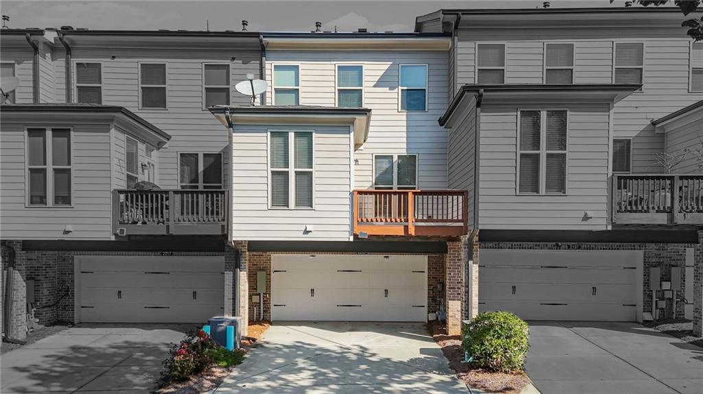 2207 Parkside Gln View Duluth, GA 30097 - Photo 38 of 41 a front view of a house with a garage