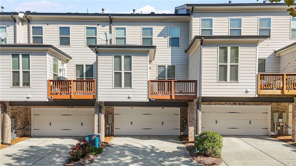 2207 Parkside Gln View Duluth, GA 30097 - Photo 39 of 41 a view of a house with large windows