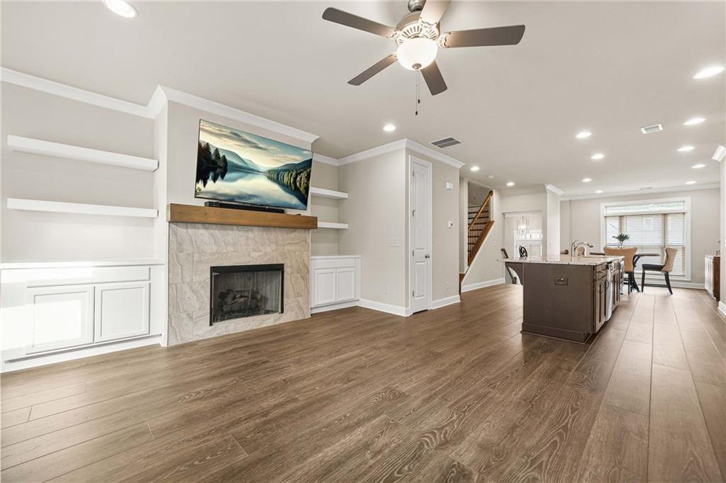 2207 Parkside Gln View Duluth, GA 30097 - Photo 9 of 41 a living room with furniture and a fireplace