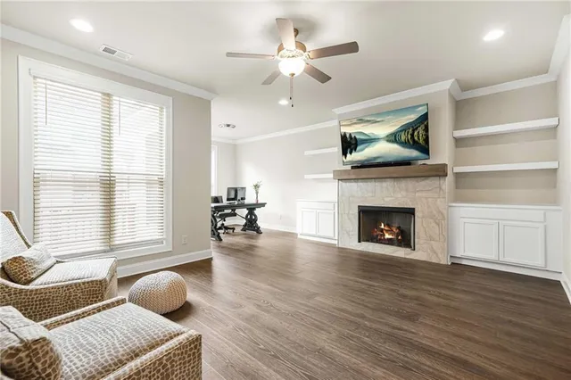 a living room with furniture and a fireplace