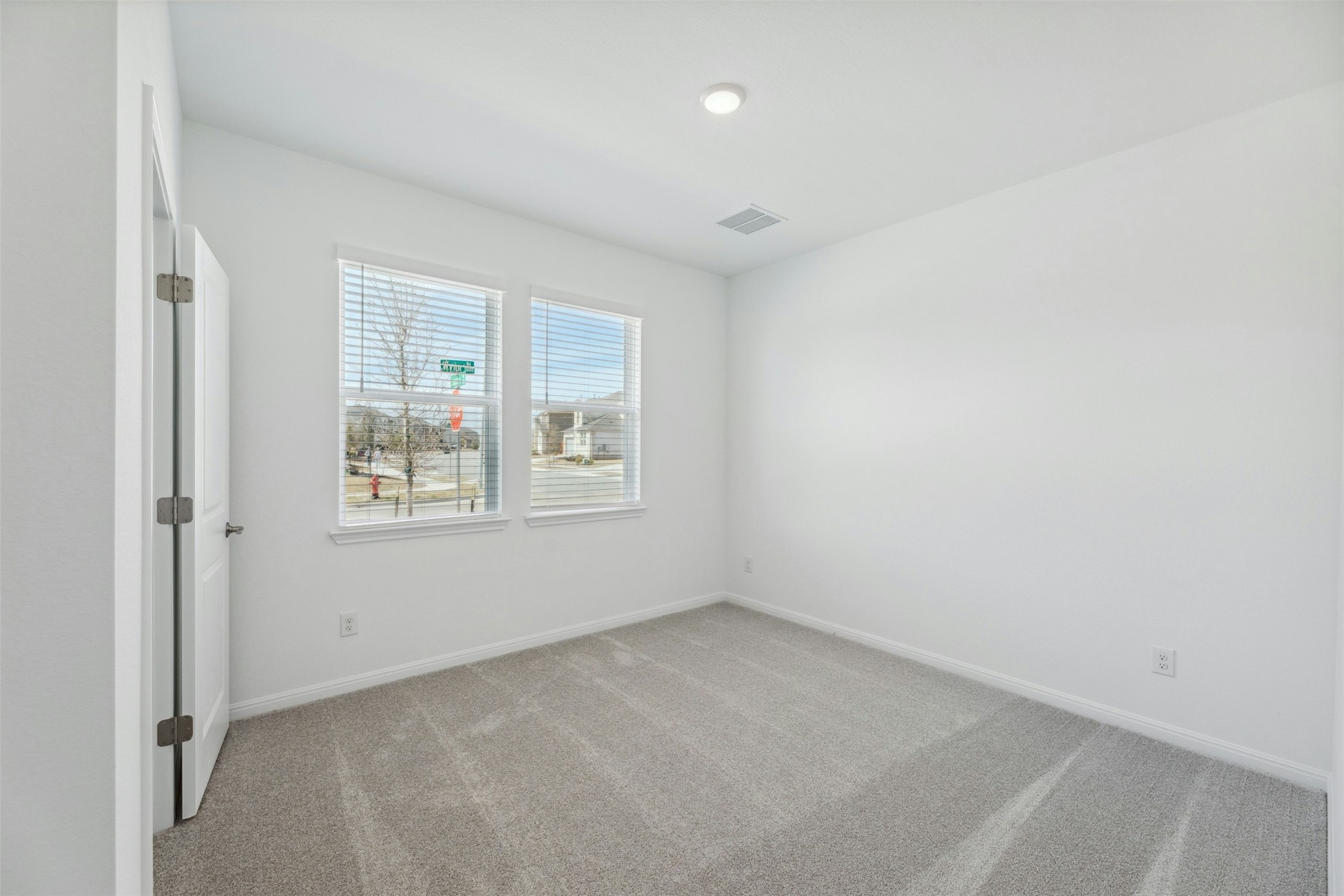 2001 Wynn Road Hutto, TX 78634 - Photo 19 of 39 A well-proportioned room with twin windows invites abundant natural light and provides a pleasant view.