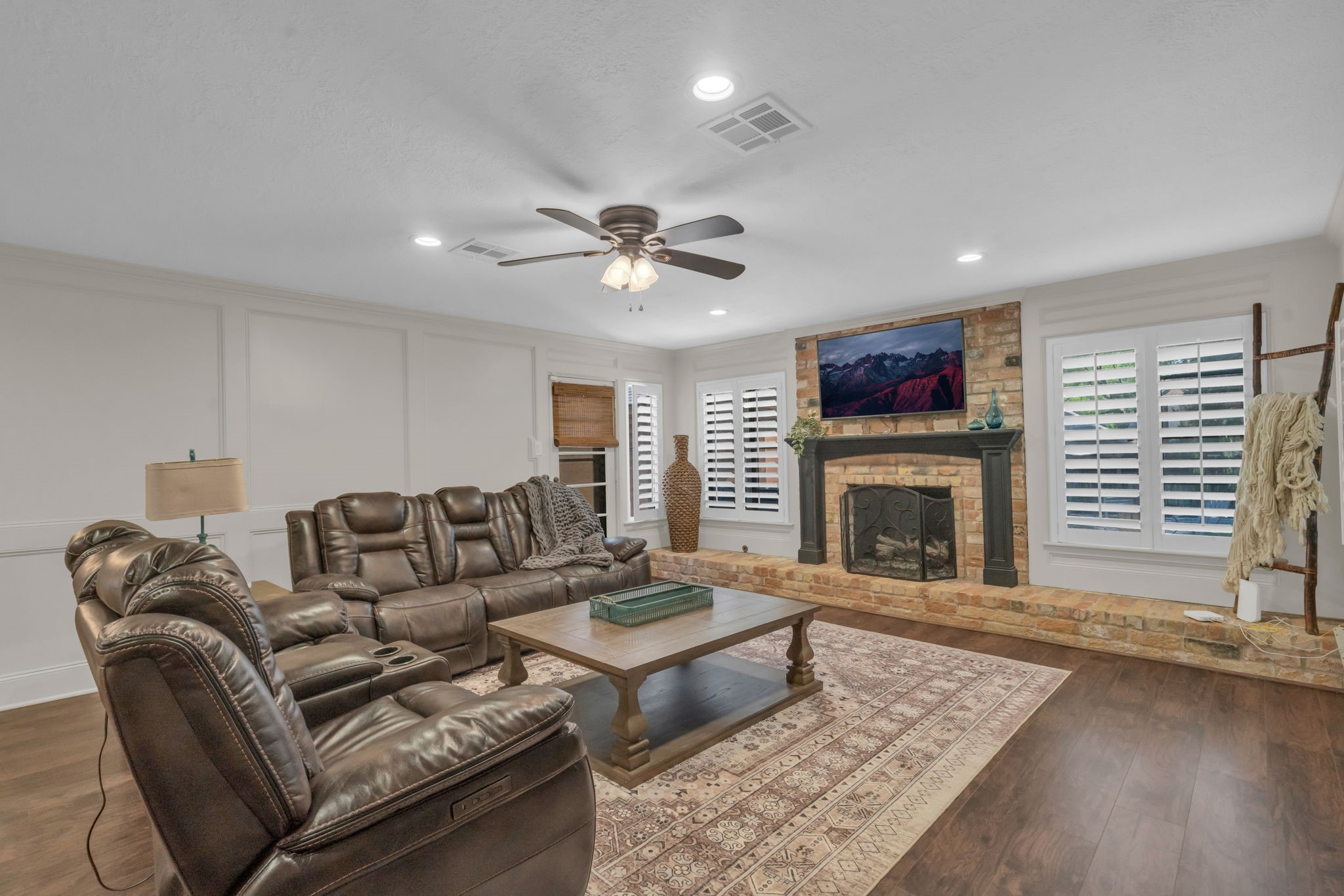 6514 Larkmount Drive Spring, TX 77389 - Photo 16 of 41 The oversized living room combines comfort, character and abundant natural light through plantation shutters and patio access.